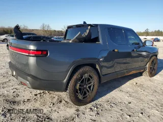 2023 Rivian R1T Adventure z VIN 7FCTGAAA1PN022134, wystawiony jako Copart lot #85545774 z przebiegiem 48 951 mil mil oraz Szkoda całkowita • Salvage title. Historia ofert i sprzedaży dostępna na DreamBid. Obrazek 3.