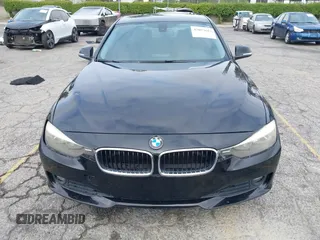 2014 BMW 3 Series 320i with VIN WBA3B1G57ENS80800, listed as a IAAI auction lot 42097683 with 152,924 mi miles. Bid and sale history available at carsss.com. Image 12.