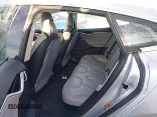 2013 Tesla Model S with VIN 5YJSA1CG3DFP28908, listed as a IAAI auction lot 41804041 with 140,756 mi miles and . Bid and sale history available at DreamBid. Image 8.