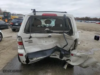 2009 Mercury Mariner Premier with VIN 4M2CU87G79KJ03236, listed as a Copart auction lot 84059324 with 130,335 mi miles and Salvage Title. Bid and sale history available at carsss.com. Image 6.