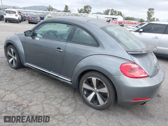 2012 Volkswagen Beetle 2.0T Turbo w/Sun/Snd/Nav PZEV with VIN 3VWVA7AT5CM653829, listed as a IAAI auction lot 42121383 with 114,474 mi miles. Bid and sale history available at carsss.com. Image 3.