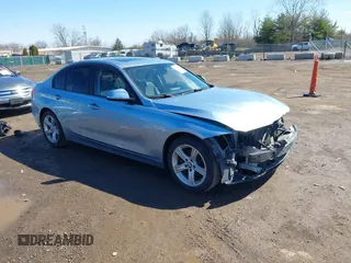 2014 BMW 3 Series 328i with VIN WBA3C1C56EAV79706, listed as a IAAI auction lot 41807033 with 104,478 mi miles. Bid and sale history available at carsss.com. Image 1.