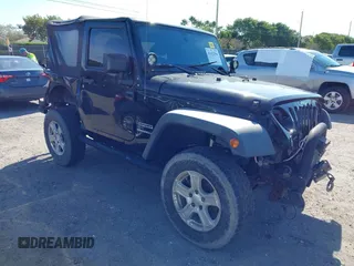 2016 Jeep Wrangler Willys Wheeler z VIN 1C4AJWAG9GL257621, wystawiony jako IAAI lot #41432306 z przebiegiem 84 248 mil mil oraz . Historia ofert i sprzedaży dostępna na DreamBid. Obrazek 1.