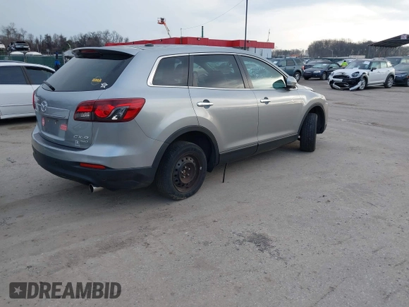 2013 Mazda CX-9 Grand Touring z VIN JM3TB3DV1D0401102, wystawiony jako IAAI lot #41248346 z przebiegiem 122 555 mil mil oraz . Historia ofert i sprzedaży dostępna na DreamBid. Obrazek 4.