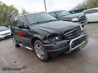 2001 Mercedes-Benz M-Class with VIN 4JGAB72E41A275216, listed as a IAAI auction lot 41953087 with 243,589 mi miles. Bid and sale history available at carsss.com. Image 1.
