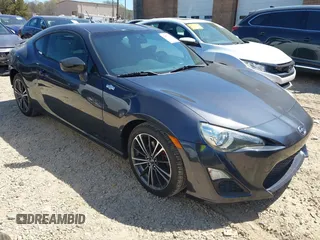 2014 Scion FR-S z VIN JF1ZNAA13E9706328, wystawiony jako IAAI lot #41853731 z przebiegiem 93 706 mil mil oraz . Historia ofert i sprzedaży dostępna na DreamBid. Obrazek 1.