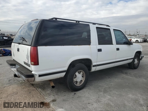 1996 Chevrolet Suburban with VIN 3GNEC16R5TG149147, listed as a Copart auction lot 84827204 with 320,305 mi miles and Salvage title. Bid and sale history available at DreamBid. Image 3.