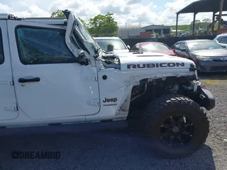 2022 Jeep Wrangler Unlimited Rubicon with VIN 1C4HJXFG8NW130156, listed as a IAAI auction lot 42004630 with 129,313 mi miles and . Bid and sale history available at DreamBid. Image 17.