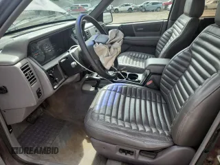 1994 Jeep Grand Cherokee Laredo z VIN 1J4GZ58S0RC221854, wystawiony jako Copart lot #61950825 z przebiegiem 69 465 mil mil oraz Czysty tytuł • Clean title. Historia ofert i sprzedaży dostępna na DreamBid. Obrazek 7.
