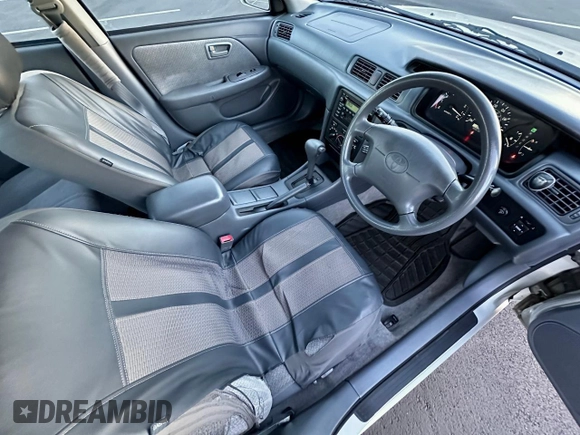 2000 Toyota Camry CE z VIN 4T1BG22K2YU669871, wystawiony jako Copart lot #57918075 z przebiegiem 164 842 mil mil oraz Czysty tytuł • Clean title. Historia ofert i sprzedaży dostępna na DreamBid. Obrazek 5.