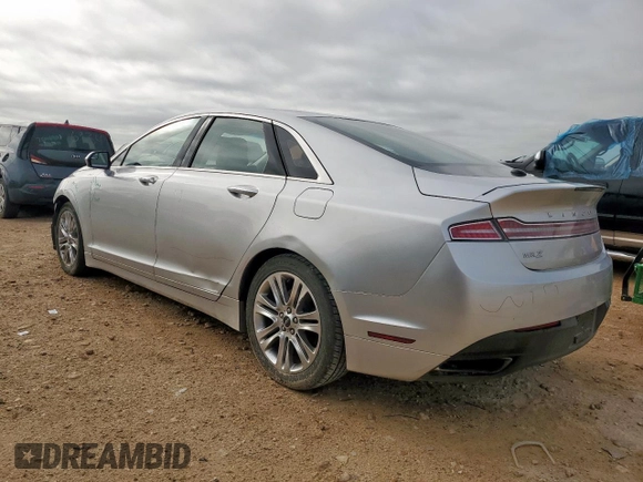 2014 Lincoln MKZ z VIN 3LN6L2G90ER815819, wystawiony jako Copart lot #61189515 z przebiegiem 101 148 mil mil oraz Szkoda całkowita • Salvage title. Historia ofert i sprzedaży dostępna na DreamBid. Obrazek 2.