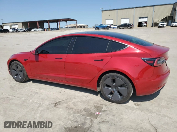 2021 Tesla Model 3 Standard Range Plus with VIN 5YJ3E1EA7MF915053, listed as a Copart auction lot 51172815 with 69,303 mi miles and Salvage Title. Bid and sale history available at DreamBid. Image 2.