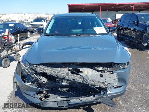 2021 Mazda CX-5 Touring with VIN JM3KFACM1M0317763, listed as a IAAI auction lot 41775712 with 75,068 mi miles. Bid and sale history available at carsss.com. Image 12.