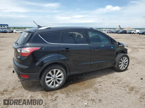 2018 Ford Escape Titanium with VIN 1FMCU9J95JUB31286, listed as a Copart auction lot 58721355 with 100,329 mi miles and Salvage title. Bid and sale history available at DreamBid. Image 3.