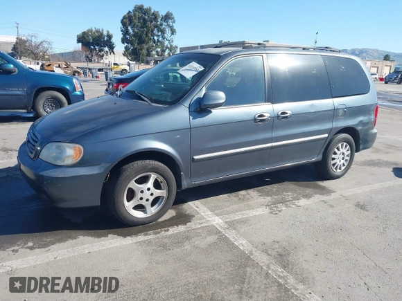 2002 Kia Sedona LX with VIN KNDUP131826297204, listed as a IAAI auction lot 41510393 with 136,337 mi miles. Bid and sale history available at carsss.com. Image 2.