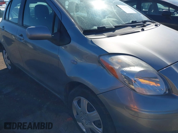 2010 Toyota Yaris with VIN JTDKT4K38A5285260, listed as a IAAI auction lot 41476373 with 104,358 mi miles. Bid and sale history available at carsss.com. Image 6.