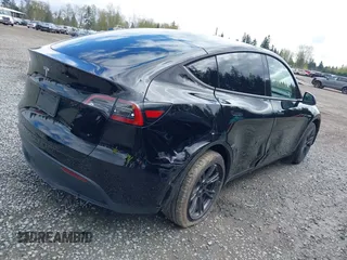 2024 Tesla Model Y with VIN 7SAYGDED3RF119101, listed as a IAAI auction lot 42019817 with 35,714 mi miles and . Bid and sale history available at DreamBid. Image 4.