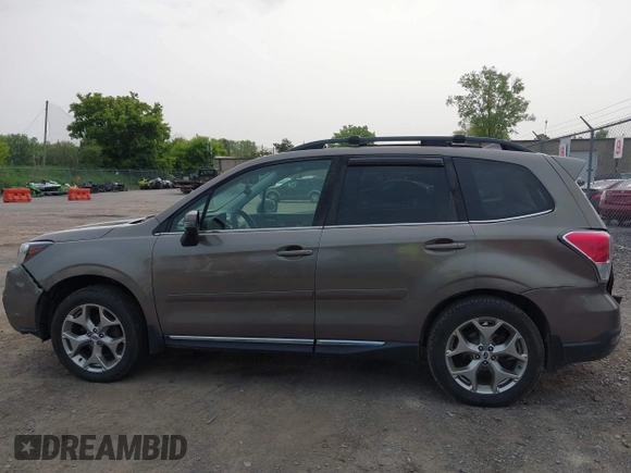 2017 Subaru Forester Touring z VIN JF2SJAWC6HH529707, wystawiony jako IAAI lot #42401138 z przebiegiem 172 868 mil mil oraz . Historia ofert i sprzedaży dostępna na DreamBid. Obrazek 14.