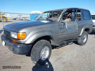 1997 Toyota Land Cruiser with VIN JT3HJ85JXV0174430, listed as a IAAI auction lot 41502690 with 300,632 mi miles. Bid and sale history available at carsss.com. Image 2.