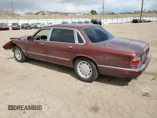 1998 Jaguar XJ Vanden Plas with VIN SAJKX6245WC830912, listed as a Copart auction lot 49717285 with 127,509 mi miles and Salvage Title. Bid and sale history available at DreamBid. Image 2.