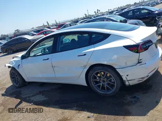 2023 Tesla Model 3 with VIN 5YJ3E1EA2PF571569, listed as a IAAI auction lot 42288715 with 30,271 mi miles and . Bid and sale history available at DreamBid. Image 14.