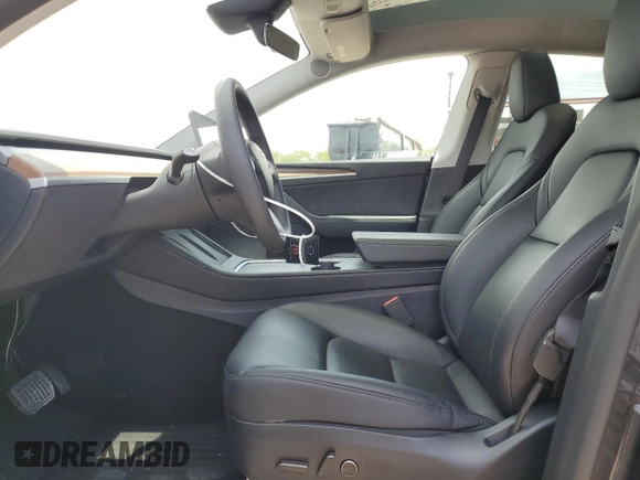 2024 Tesla Model Y Long Range with VIN 7SAYGAEE5RF088151, listed as a Copart auction lot 52651015 with 6,185 mi miles and Clean title. Bid and sale history available at DreamBid. Image 7.
