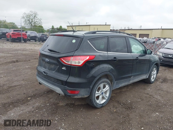2015 Ford Escape SE with VIN 1FMCU9GX5FUB99018, listed as a IAAI auction lot 42250840 with 126,850 mi miles and . Bid and sale history available at DreamBid. Image 4.