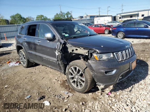 2017 Jeep Grand Cherokee Overland with VIN 1C4RJFCG0HC762612, listed as a Copart auction lot 57400095 with 122,702 mi miles and Salvage title. Bid and sale history available at DreamBid. Image 4.