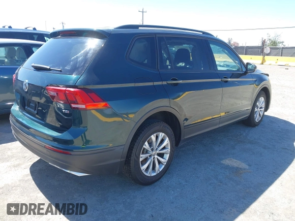 2018 Volkswagen Tiguan S with VIN 3VV1B7AX1JM165641, listed as a IAAI auction lot 42699622 with 75,354 mi miles and . Bid and sale history available at DreamBid. Image 4.