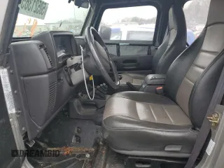 2000 Jeep Wrangler Sport with VIN 1J4FA49S4YP789348, listed as a Copart auction lot 50521365 with 0 mi miles and Salvage Title. Bid and sale history available at carsss.com. Image 7.