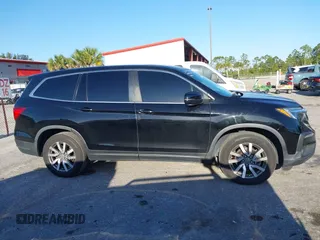 2021 Honda Pilot EX-L with VIN 5FNYF5H55MB044677, listed as a IAAI auction lot 42038704 with 38,684 mi miles and . Bid and sale history available at carsss.com. Image 14.