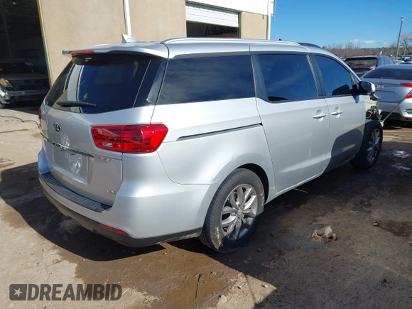 2021 Kia Sedona EX with VIN KNDMB5C11M6664811, listed as a IAAI auction lot 41390328 with 128,568 mi miles. Bid and sale history available at carsss.com. Image 4.
