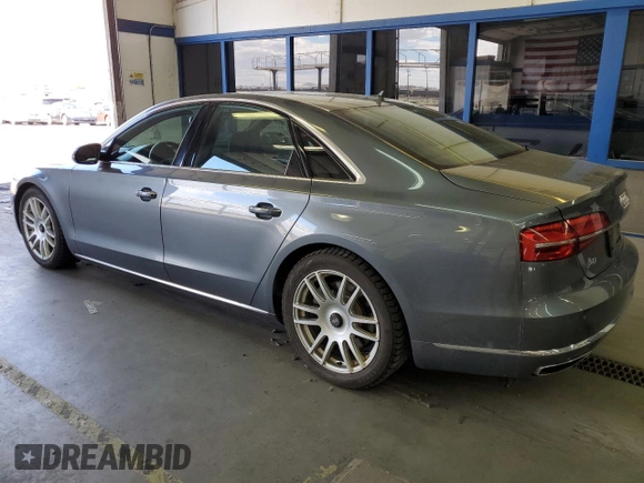 2015 Audi A8 with VIN WAUJGAFD3FN016587, listed as a Copart auction lot 60778904 with 116,818 mi miles and Clean title. Bid and sale history available at DreamBid. Image 2.