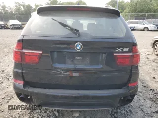 2012 BMW X5 35i with VIN 5UXZV4C5XCL761370, listed as a Copart auction lot 59436845 with 124,722 mi miles and Salvage title. Bid and sale history available at DreamBid. Image 6.