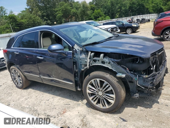 2017 Cadillac XT5 Premium Luxury AWD with VIN 1GYKNERS0HZ239805, listed as a Copart auction lot 61257435 with 104,448 mi miles and Salvage title. Bid and sale history available at DreamBid. Image 4.