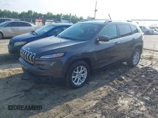 2014 Jeep Cherokee Latitude with VIN 1C4PJLCB6EW241897, listed as a IAAI auction lot 42128880 with 126,242 mi miles. Bid and sale history available at carsss.com. Image 2.