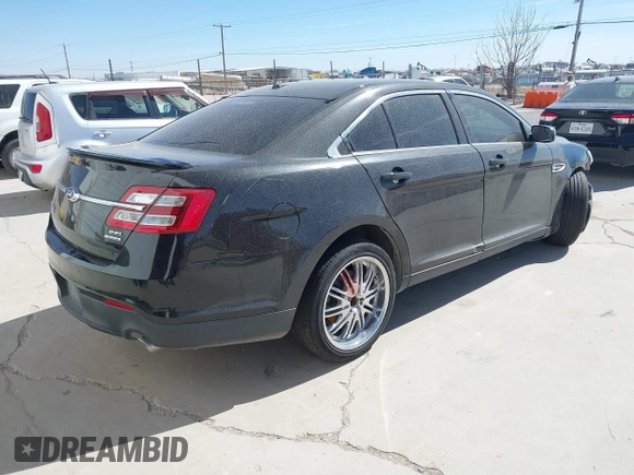 2014 Ford Taurus SEL with VIN 1FAHP2E83EG184976, listed as a IAAI auction lot 41590153 with 177,342 mi miles. Bid and sale history available at carsss.com. Image 4.