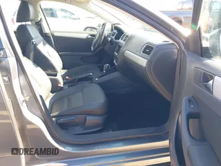 2012 Volkswagen Jetta TDI w/Premium & Nav z VIN 3VWLL7AJ5CM361646, wystawiony jako IAAI lot #41856672 z przebiegiem 190 292 mil mil oraz . Historia ofert i sprzedaży dostępna na DreamBid. Obrazek 5.