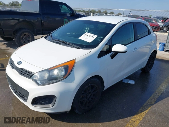 2015 Kia Rio LX with VIN KNADM5A39F6500074, listed as a IAAI auction lot 41871224 with 126,209 mi miles. Bid and sale history available at carsss.com. Image 2.
