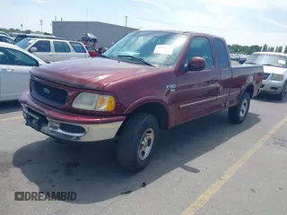 1998 Ford F-150 with VIN 1FTZX18W9WKC09638, listed as a IAAI auction lot 42576838 with 140,714 mi miles and . Bid and sale history available at DreamBid. Image 2.