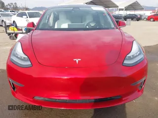 2020 Tesla Model 3 Standard Range Plus with VIN 5YJ3E1EA9LF718027, listed as a IAAI auction lot 41679320 with 68,987 mi miles. Bid and sale history available at carsss.com. Image 12.
