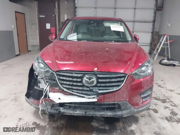 2016 Mazda CX-5 Grand Touring with VIN JM3KE4DY8G0622347, listed as a IAAI auction lot 41618997 with NaN miles. Bid and sale history available at carsss.com. Image 13.
