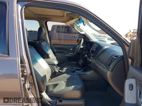 2005 Mazda Tribute S with VIN 4F2CZ06175KM49643, listed as a IAAI auction lot 41397843 with 185,088 mi miles and . Bid and sale history available at carsss.com. Image 5.