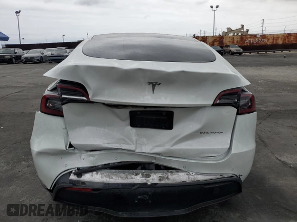 2021 Tesla Model Y Long Range with VIN 5YJYGDEEXMF151686, listed as a Copart auction lot 53903115 with 65,321 mi miles and Salvage Title. Bid and sale history available at DreamBid. Image 6.