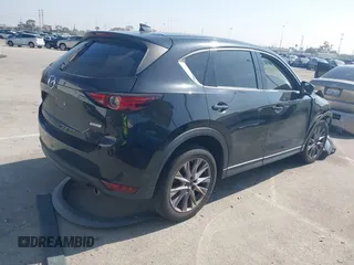 2019 Mazda CX-5 Grand Touring with VIN JM3KFADMXK1547727, listed as a IAAI auction lot 42138071 with Not provided miles and . Bid and sale history available at DreamBid. Image 4.