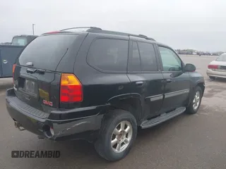 2002 GMC Envoy SLT with VIN 1GKDT13S222143135, listed as a IAAI auction lot 42136672 with 206,064 mi miles. Bid and sale history available at carsss.com. Image 4.