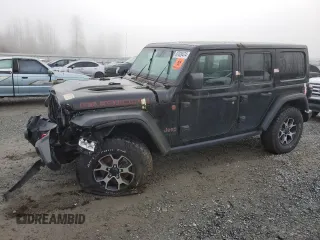 2021 Jeep Wrangler Unlimited Rubicon with VIN 1C4JJXFM7MW818199, listed as a Copart auction lot 87428474 with 18,696 mi miles and Salvage Title. Bid and sale history available at carsss.com. Image 1.