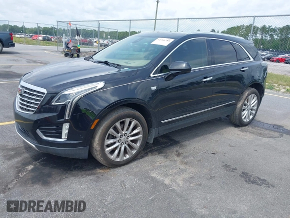2017 Cadillac XT5 Platinum AWD z VIN 1GYKNFRS9HZ125677, wystawiony jako IAAI lot #42366784 z przebiegiem 152 116 mil mil oraz . Historia ofert i sprzedaży dostępna na DreamBid. Obrazek 2.