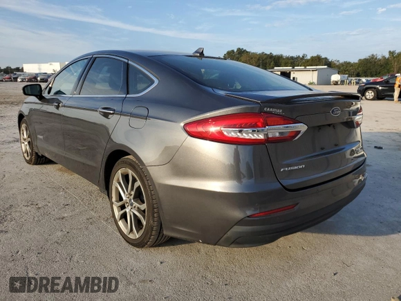 2019 Ford Fusion Hybrid Titanium with VIN 3FA6P0RU9KR116785, listed as a Copart auction lot 68052202 with 89,486 mi miles. Bid and sale history available at carsss.com. Image 2.