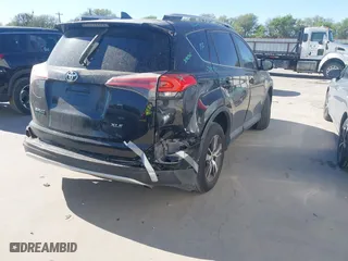 2016 Toyota RAV4 XLE with VIN 2T3WFREV3GW276390, listed as a IAAI auction lot 41829173 with 138,293 mi miles. Bid and sale history available at carsss.com. Image 4.